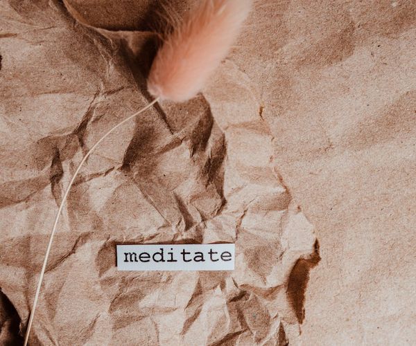 A compass pointing towards the word 'well-being' on a minimalist background.